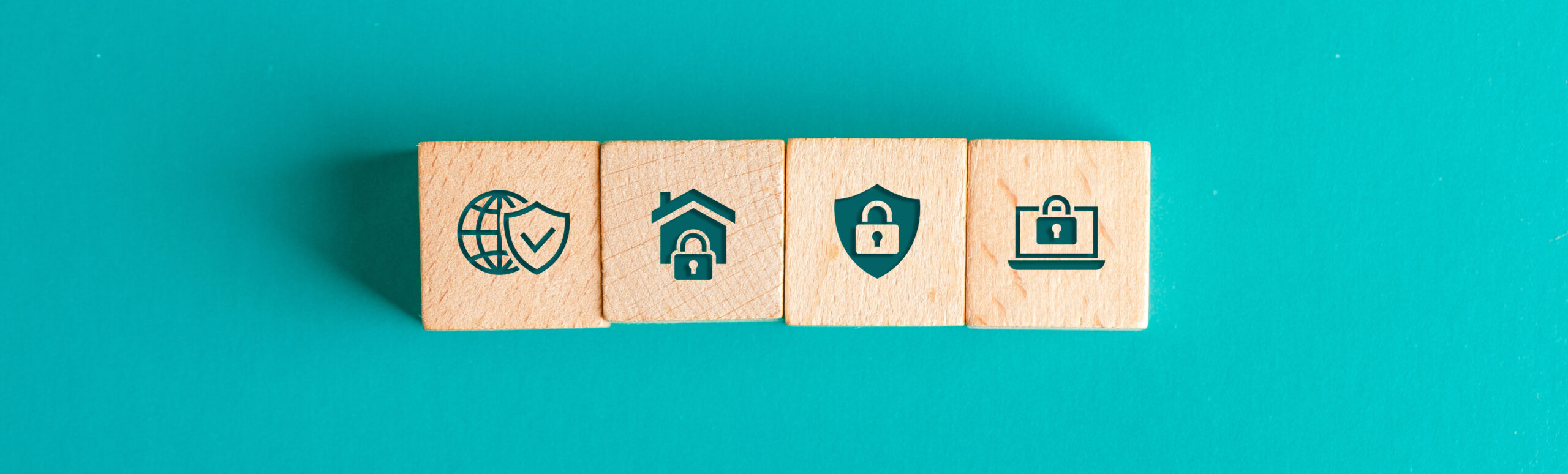 Security concept with icons on wooden blocks on turquoise backgr
